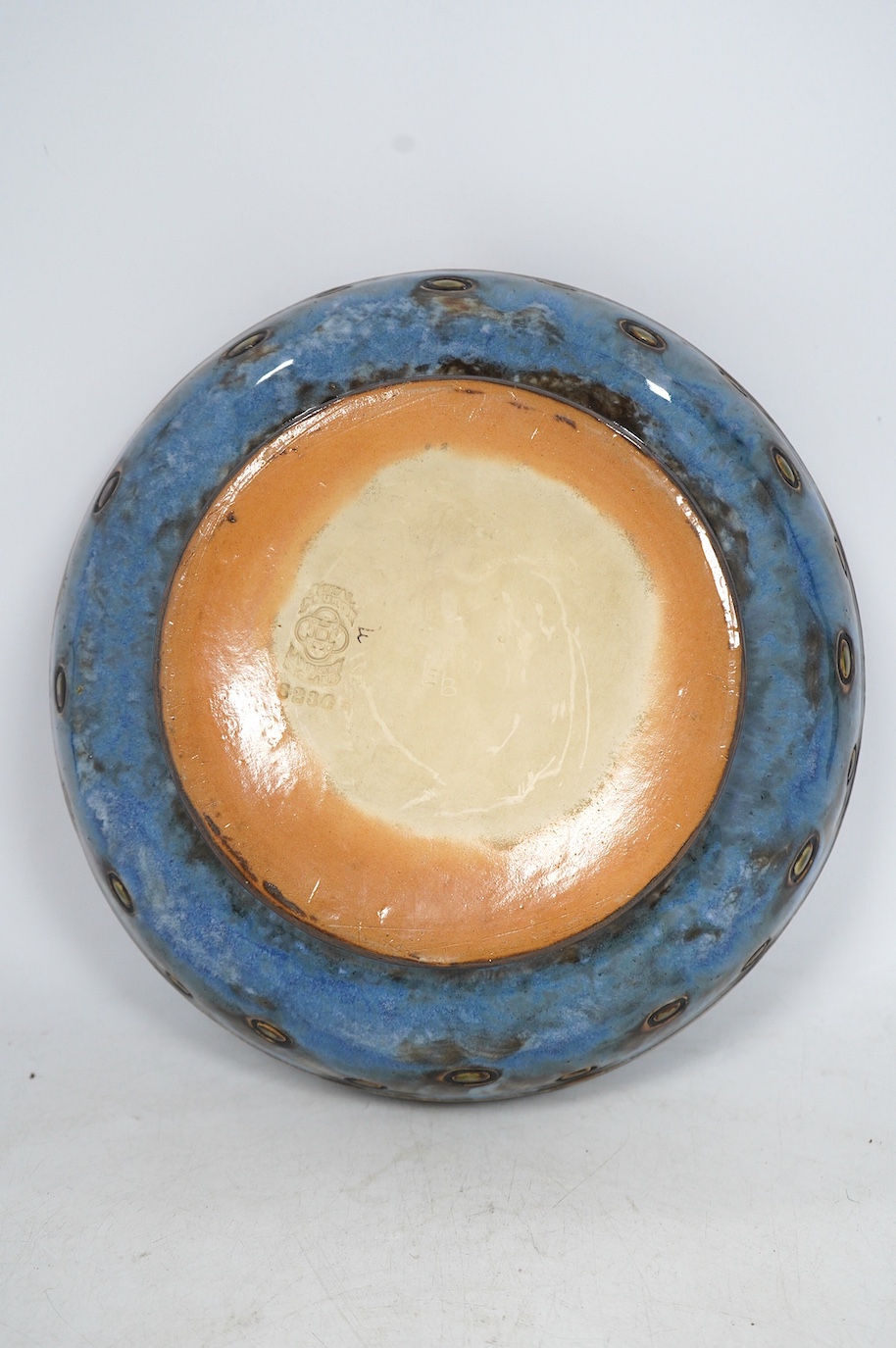 A Royal Doulton blue bowl, designed by Ethel Beard and monogrammed to the base, 25cm diameter. Condition - good